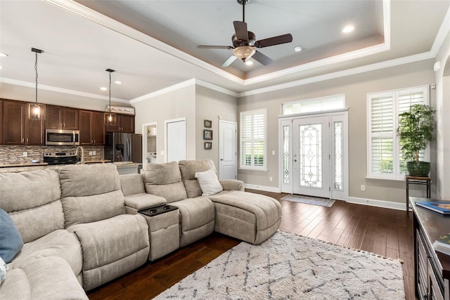 2898 SW 117th Way, Gainesville, FL 32608 - living room featuring a tray ceiling, dark wood-style floors, a ceiling fan, baseboards, and recessed lighting
