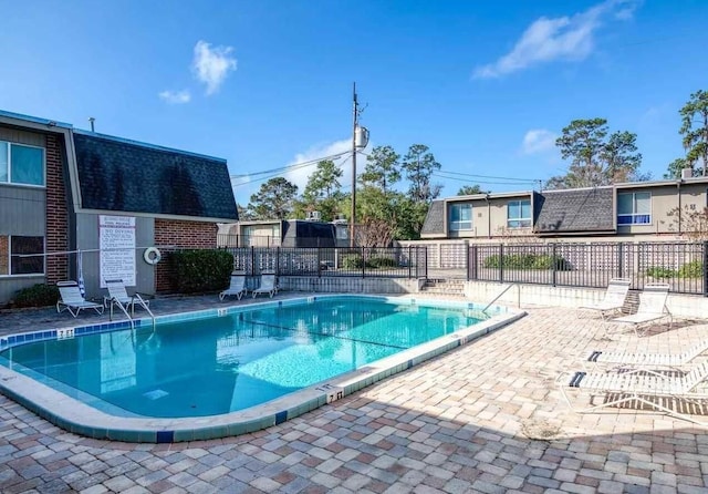 1700 SW 16th Ct Unit J22, Gainesville, FL 32608 - community pool featuring a patio