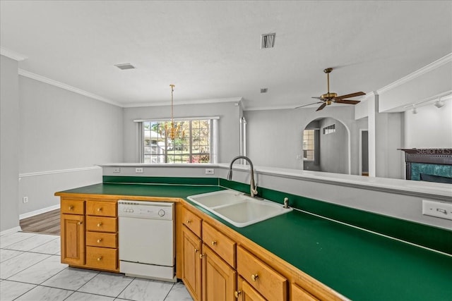 11737 Creek Dr, Alachua, FL 32615 - kitchen with dishwasher, a sink, light marble finish flooring, a ceiling fan, and brown cabinetry