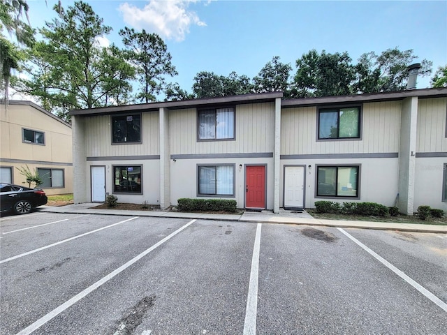2300 SW 43rd St Unit L2, Gainesville, FL 32607 - view of property featuring uncovered parking
