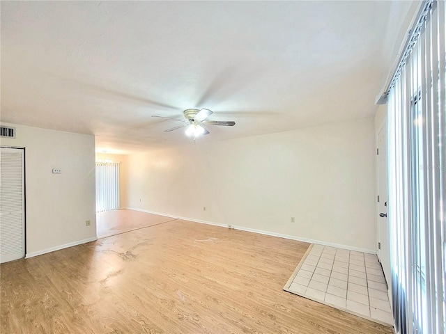 2300 SW 43rd St Unit L2, Gainesville, FL 32607 - unfurnished room with ceiling fan, light wood-style floors, and baseboards