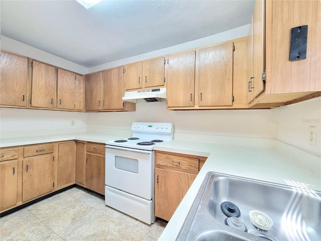 2300 SW 43rd St Unit L2, Gainesville, FL 32607 - kitchen featuring white range with electric cooktop, under cabinet range hood, light countertops, and a sink