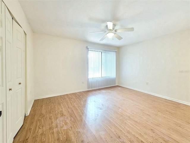 2300 SW 43rd St Unit L2, Gainesville, FL 32607 - unfurnished bedroom with light wood-style flooring, baseboards, and ceiling fan