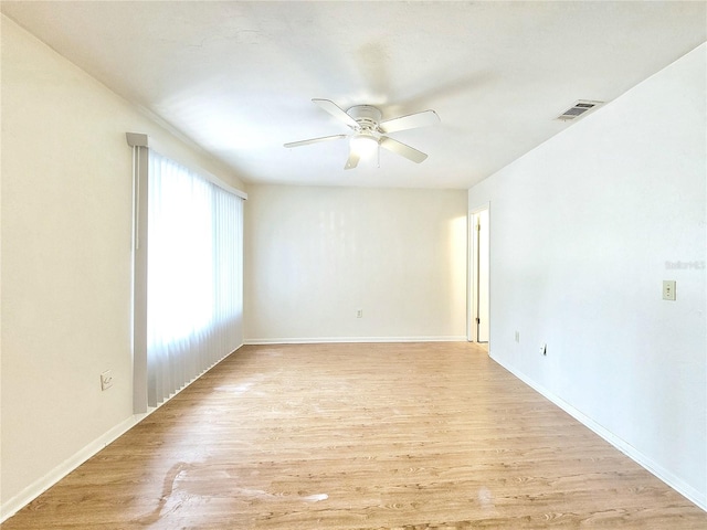 2300 SW 43rd St Unit L2, Gainesville, FL 32607 - unfurnished room featuring a ceiling fan, light wood-style floors, and baseboards