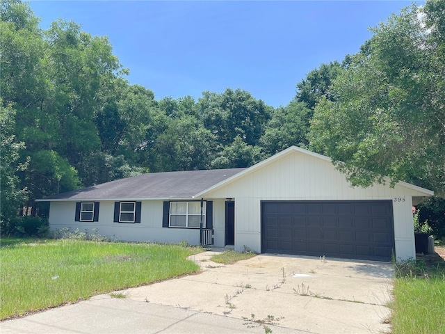 395 SW Grove St, Keystone Heights, FL 32656 - ranch-style home featuring an attached garage, driveway, and a front yard