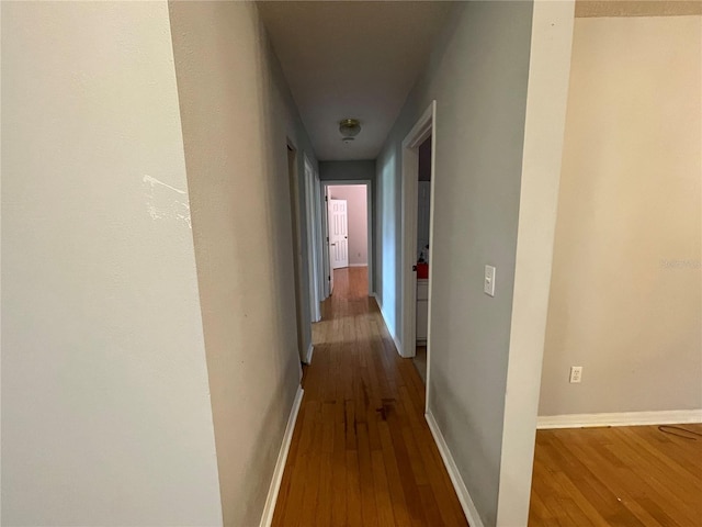 395 SW Grove St, Keystone Heights, FL 32656 - hallway featuring wood-type flooring and baseboards