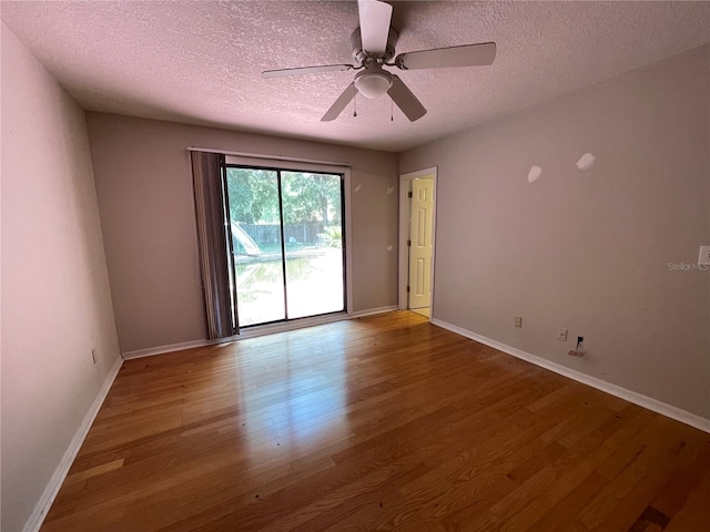 395 SW Grove St, Keystone Heights, FL 32656 - spare room featuring wood finished floors, a textured ceiling, baseboards, and a ceiling fan