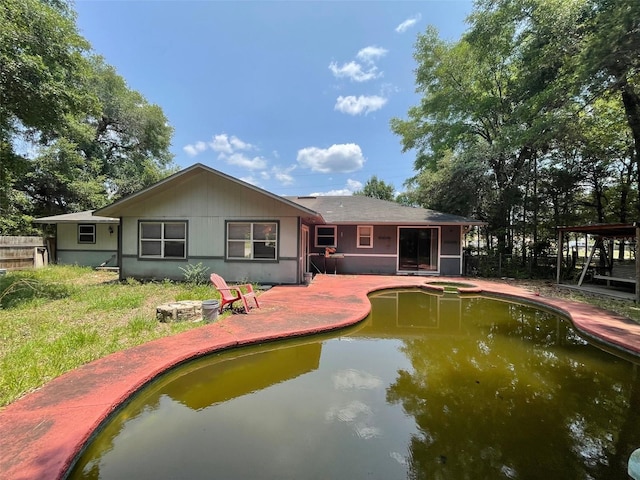 395 SW Grove St, Keystone Heights, FL 32656 - rear view of house featuring a pool with connected hot tub and a patio