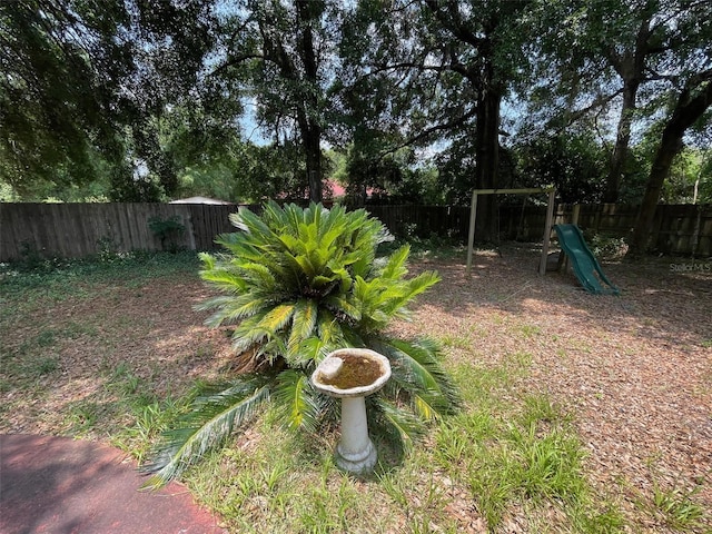395 SW Grove St, Keystone Heights, FL 32656 - fenced backyard with a playground