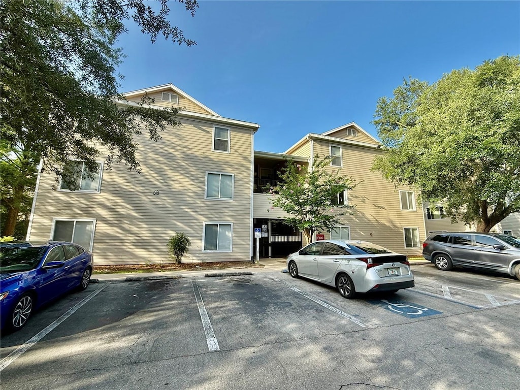 3800 SW 20th Ave Unit 308, Gainesville, FL 32607 - view of property featuring uncovered parking