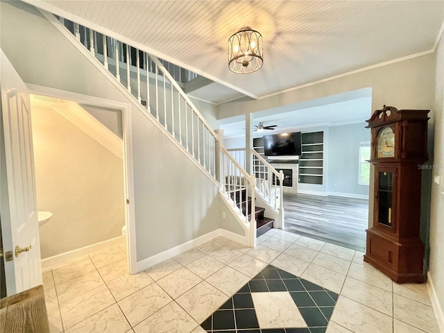 5510 NW 80th Ave, Gainesville, FL 32653 - stairs featuring baseboards, a ceiling fan, crown molding, a chandelier, and marble look tile flooring