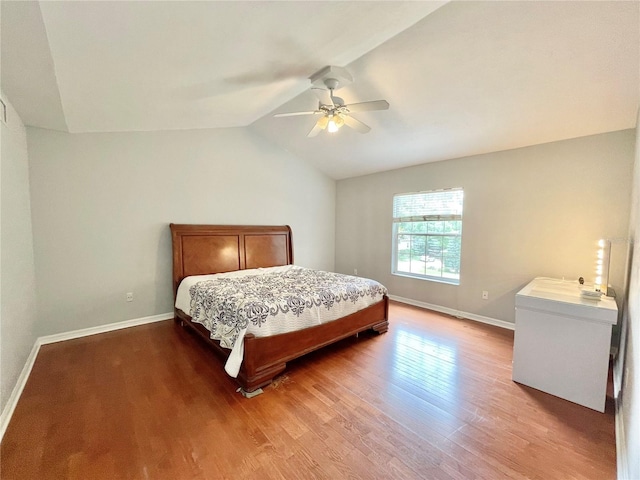 5510 NW 80th Ave, Gainesville, FL 32653 - bedroom with wood finished floors, baseboards, lofted ceiling, and ceiling fan