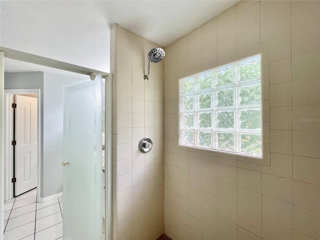 5510 NW 80th Ave, Gainesville, FL 32653 - bathroom featuring tiled shower and tile patterned flooring