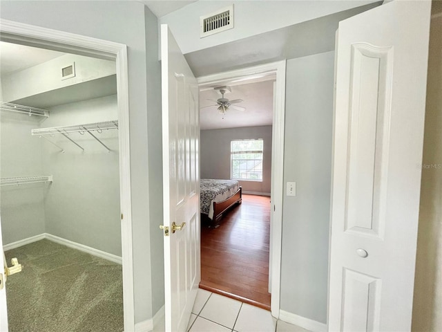 5510 NW 80th Ave, Gainesville, FL 32653 - corridor featuring baseboards and tile patterned floors