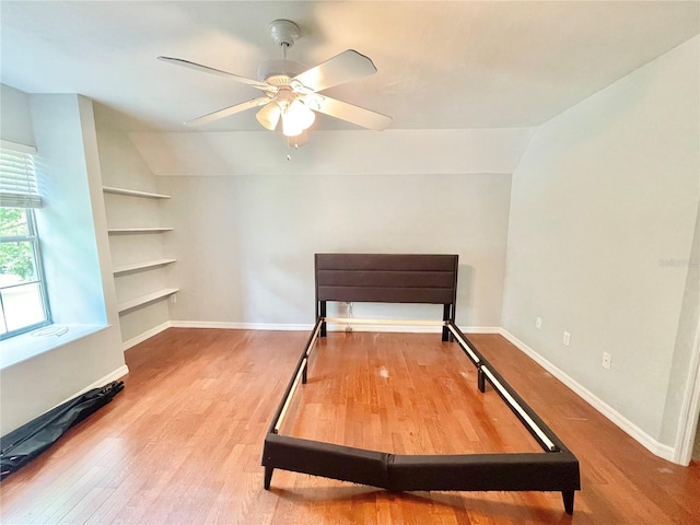 5510 NW 80th Ave, Gainesville, FL 32653 - unfurnished bedroom featuring vaulted ceiling, wood finished floors, baseboards, and ceiling fan