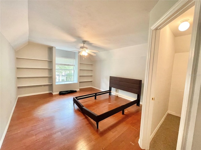 5510 NW 80th Ave, Gainesville, FL 32653 - bedroom with wood finished floors, baseboards, lofted ceiling, and ceiling fan