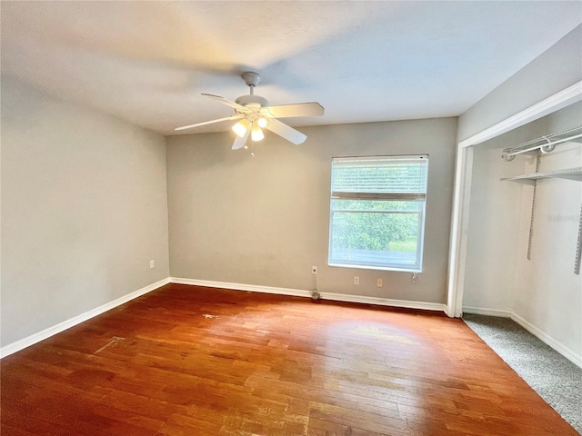 5510 NW 80th Ave, Gainesville, FL 32653 - unfurnished bedroom featuring wood finished floors, baseboards, ceiling fan, and a closet