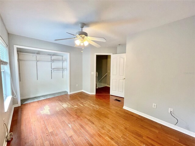5510 NW 80th Ave, Gainesville, FL 32653 - unfurnished bedroom with wood finished floors, a closet, and baseboards
