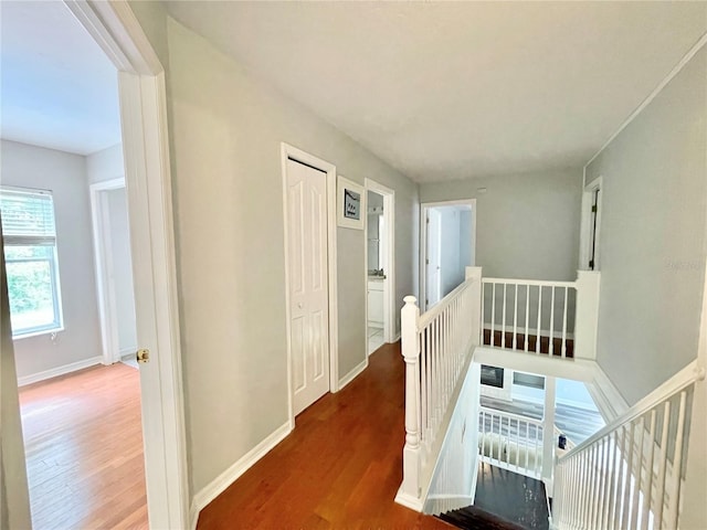 5510 NW 80th Ave, Gainesville, FL 32653 - corridor featuring an upstairs landing, wood finished floors, and baseboards