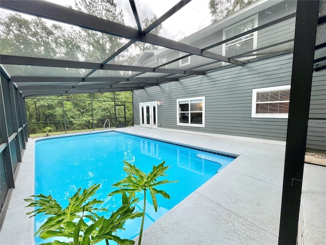 5510 NW 80th Ave, Gainesville, FL 32653 - outdoor pool featuring a patio, french doors, and glass enclosure