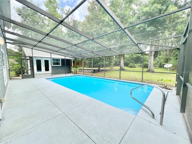 5510 NW 80th Ave, Gainesville, FL 32653 - swimming pool featuring french doors, a patio area, glass enclosure, and a yard