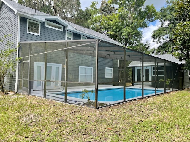 5510 NW 80th Ave, Gainesville, FL 32653 - back of house with a lawn, an outdoor pool, and a lanai