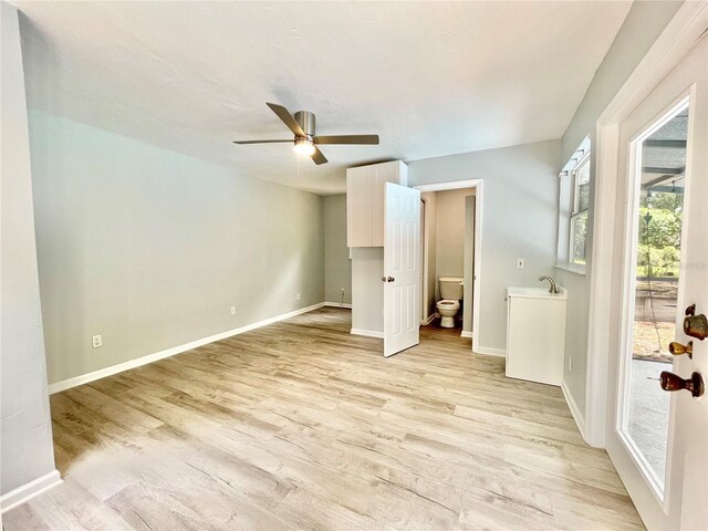 5510 NW 80th Ave, Gainesville, FL 32653 - unfurnished bedroom with light wood-style floors, baseboards, access to exterior, and a ceiling fan