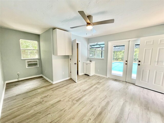 5510 NW 80th Ave, Gainesville, FL 32653 - unfurnished living room with light wood-type flooring, healthy amount of natural light, baseboards, and ceiling fan