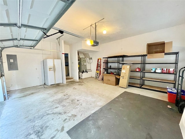 5510 NW 80th Ave, Gainesville, FL 32653 - garage featuring electric panel, white refrigerator with ice dispenser, and a garage door opener