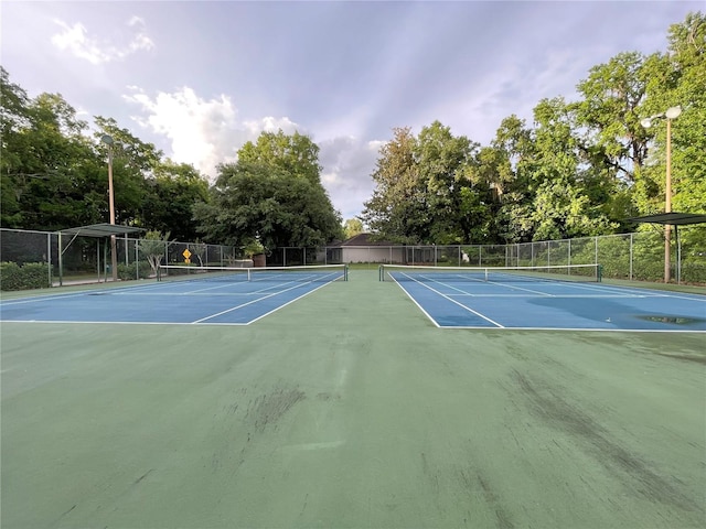 5510 NW 80th Ave, Gainesville, FL 32653 - view of tennis court featuring community basketball court and view of wooded area