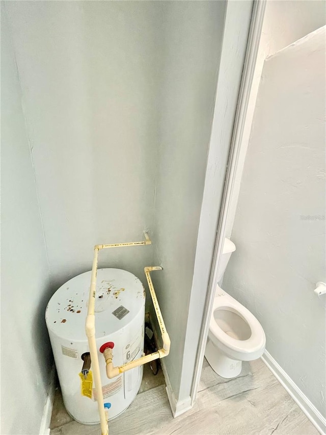 5510 NW 80th Ave, Gainesville, FL 32653 - bathroom featuring wood finished floors and toilet