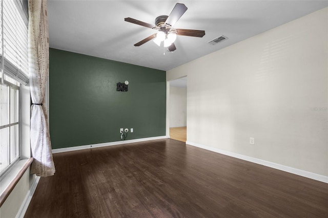 5806 NW 26th Ter, Gainesville, FL 32653 - empty room featuring wood finished floors, ceiling fan, and baseboards