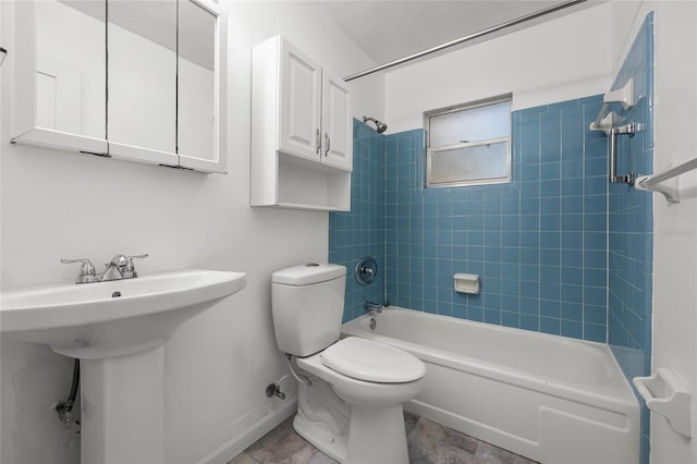 5806 NW 26th Ter, Gainesville, FL 32653 - full bathroom with shower / washtub combination, toilet, a sink, and baseboards