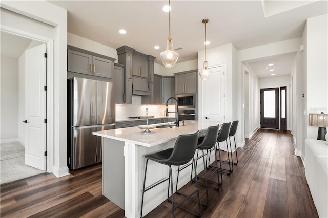 3225 SW 120th Ter, Gainesville, FL 32608 - kitchen with appliances with stainless steel finishes, gray cabinets, light countertops, a sink, and recessed lighting