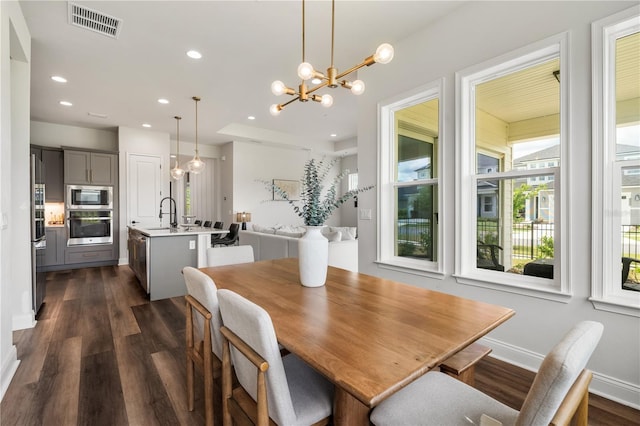 3225 SW 120th Ter, Gainesville, FL 32608 - dining room featuring a chandelier, dark wood-style flooring, recessed lighting, and baseboards