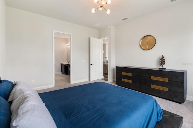 3225 SW 120th Ter, Gainesville, FL 32608 - bedroom featuring carpet floors, a chandelier, baseboards, and ensuite bathroom