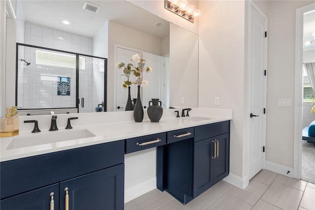 3225 SW 120th Ter, Gainesville, FL 32608 - bathroom with double vanity, a shower stall, tile patterned floors, and plenty of natural light