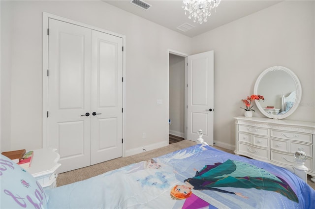 3225 SW 120th Ter, Gainesville, FL 32608 - carpeted bedroom with a closet, a chandelier, and baseboards