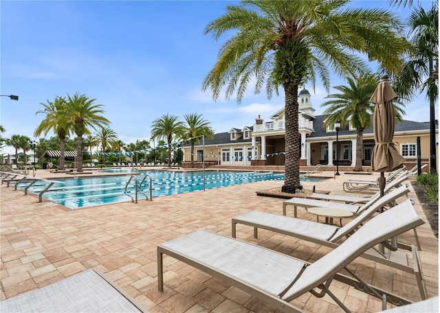 3225 SW 120th Ter, Gainesville, FL 32608 - community pool with french doors and a patio