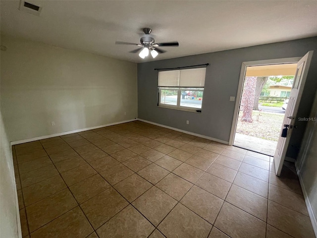1702 NE 15th Ter, Gainesville, FL 32609 - tiled spare room with ceiling fan and baseboards