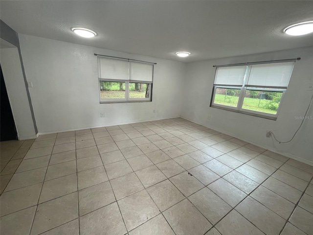 1702 NE 15th Ter, Gainesville, FL 32609 - unfurnished room featuring tile patterned flooring