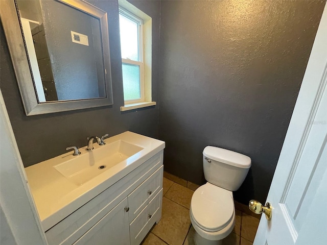 1702 NE 15th Ter, Gainesville, FL 32609 - half bath with vanity, toilet, and tile patterned floors