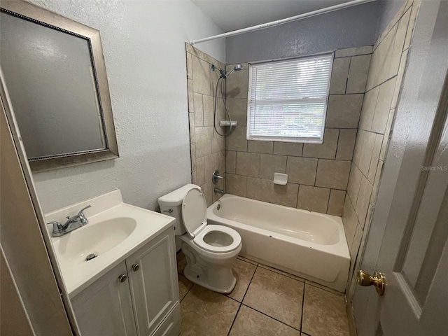 1702 NE 15th Ter, Gainesville, FL 32609 - full bathroom featuring toilet, shower / bath combination, vanity, a textured wall, and tile patterned flooring