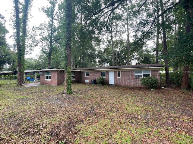 1702 NE 15th Ter, Gainesville, FL 32609 - view of front of property with brick siding and central air condition unit