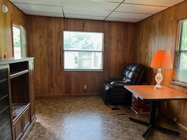 16431 NW US Highway 441, Alachua, FL 32615 - living area featuring wood walls, baseboards, and dark flooring
