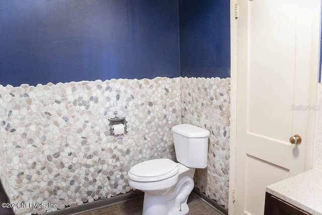 762 N Walnut St, Starke, FL 32091 - bathroom featuring toilet and wood finished floors