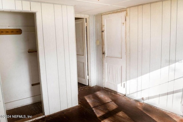 762 N Walnut St, Starke, FL 32091 - corridor with wooden walls and wood finished floors