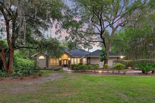 10303 SW 21st Ave, Gainesville, FL 32607 - ranch-style house with a yard