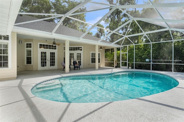 10303 SW 21st Ave, Gainesville, FL 32607 - outdoor pool with french doors, ceiling fan, a patio area, and glass enclosure
