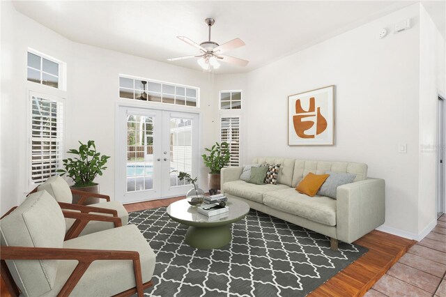 10303 SW 21st Ave, Gainesville, FL 32607 - living room featuring ceiling fan, french doors, baseboards, and wood finished floors